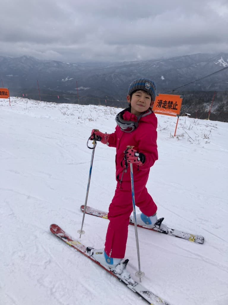 Student skiing on a snowy mountain during the SSW winter program