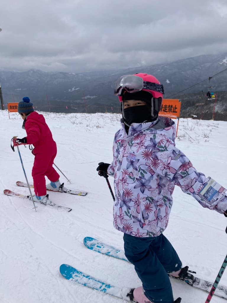 Student skiing on a snowy mountain during the SSW winter program