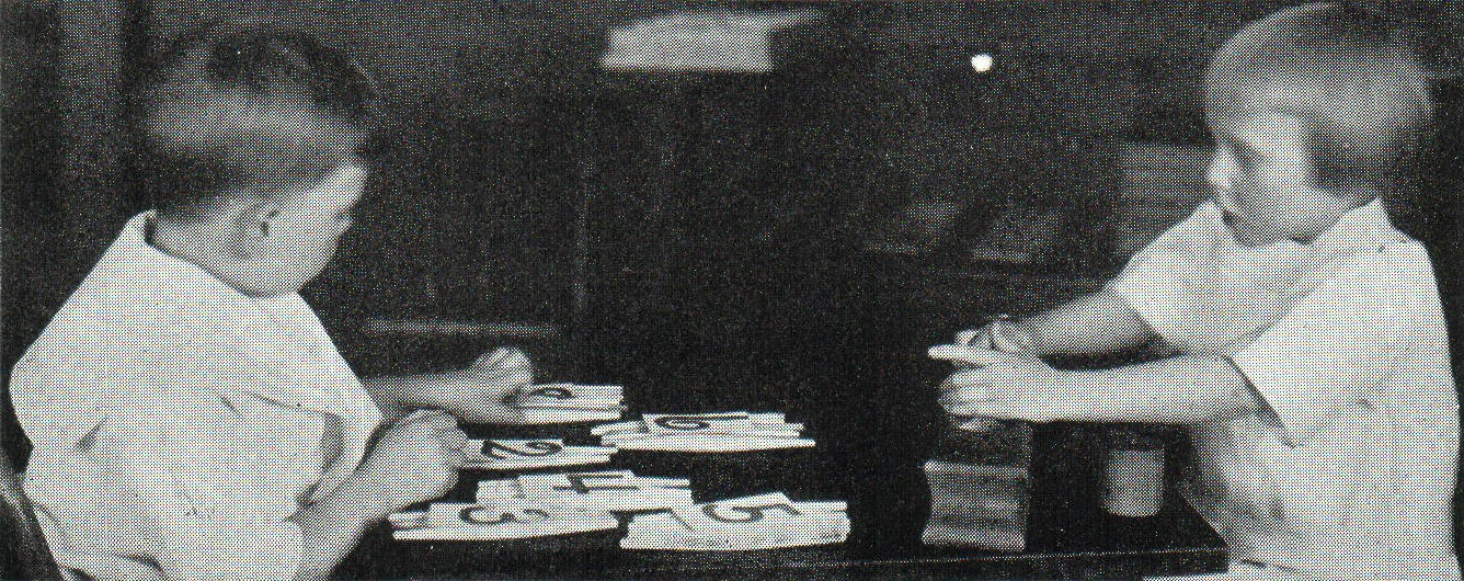 Children working with Montessori counting and geometry materials, circa 1914