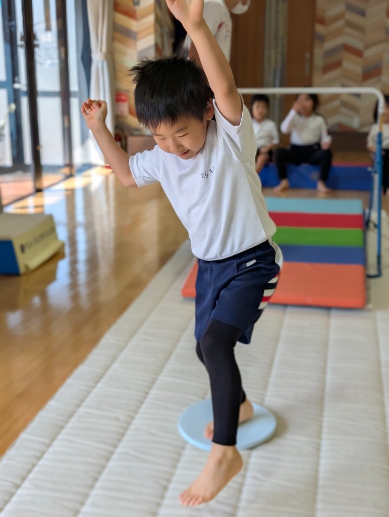 Student practicing on the gymnastics bar