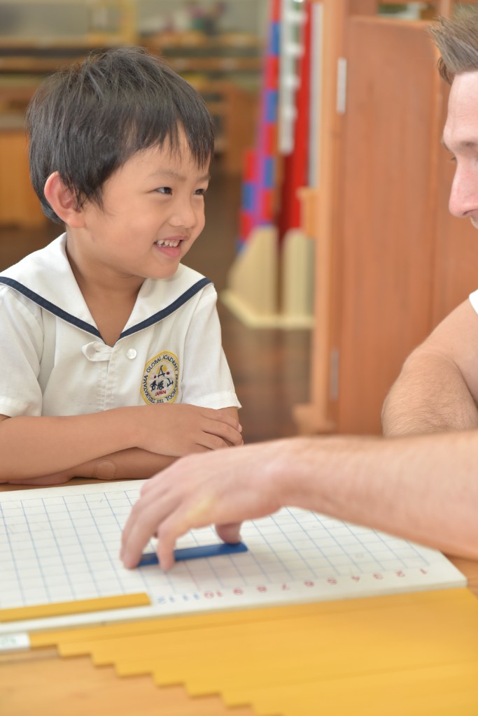 One-to-one Montessori math lesson with number rods and a teacher